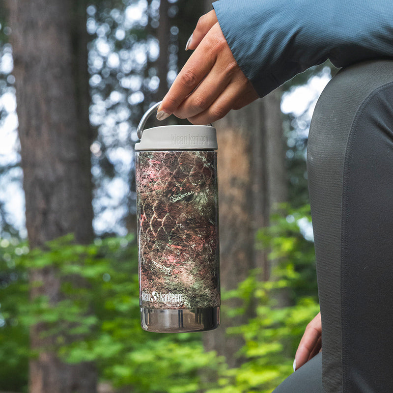 12oz-tkwide-with-twist-cap-mossy-oak-m1 12oz_tumbler_mossyoak_rainbowtrout_hand_closeup_square.jpg