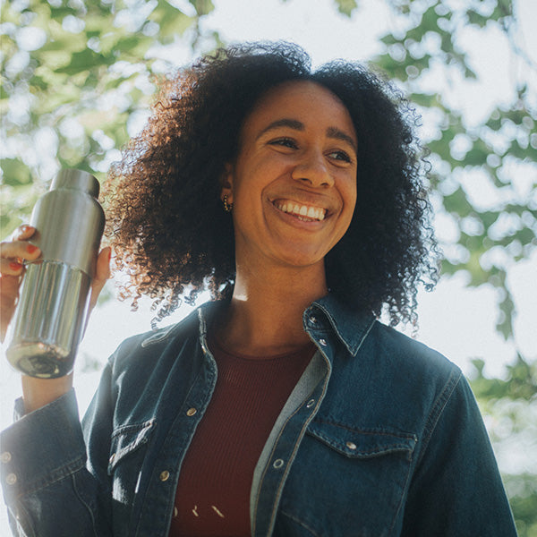 bring-your-own-party-kit-tumblers-and-cocktails-m6 16oz_rise_reflect_woman_smile_square.jpg