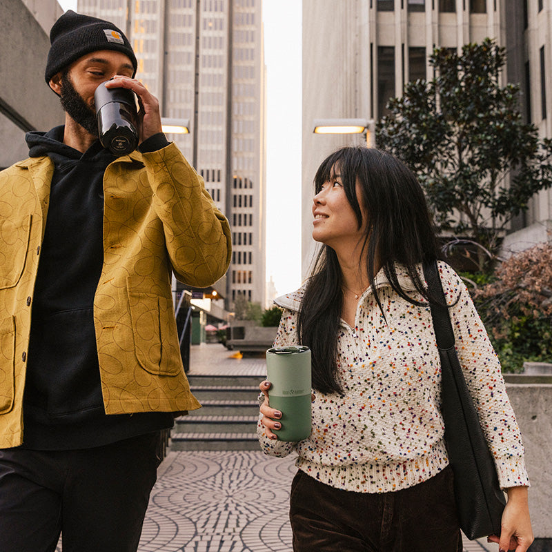 bring-your-own-party-kit-pints-and-tumblers-m8 16oz_rise_tumbler_black_iceberg_couple_drink_city_street_square.jpg