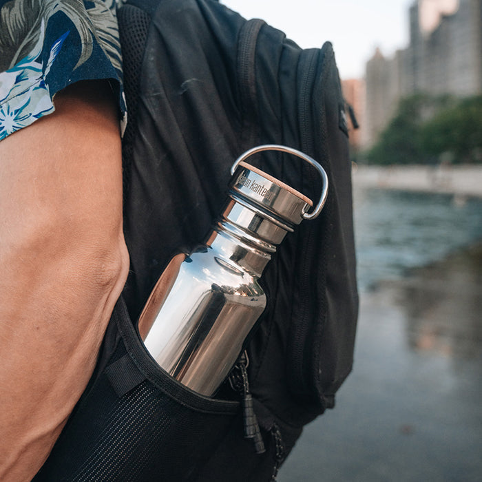27oz-reflect-with-bamboo-cap-q4 K27SSLRF-MS-BAMBOO_reflect-bottle_backpack_lifestyle.jpg